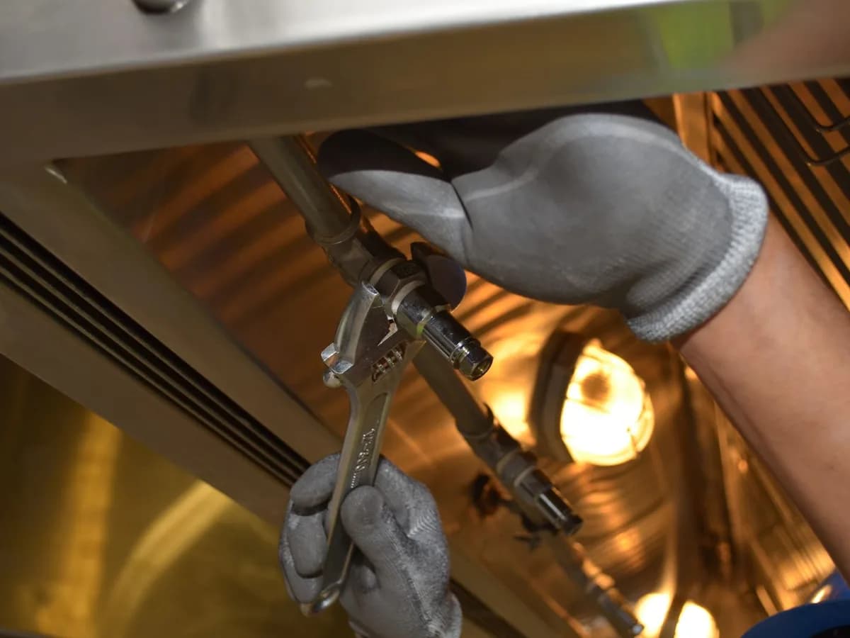 Plumber checking household pipework